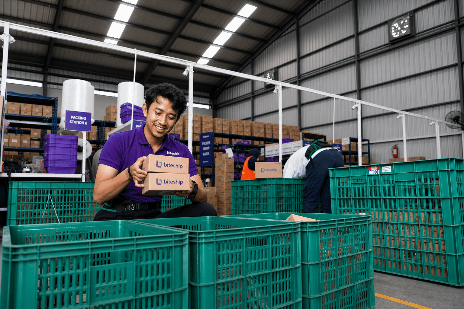 Biteship team member preparing health product packages in a fulfillment warehouse
